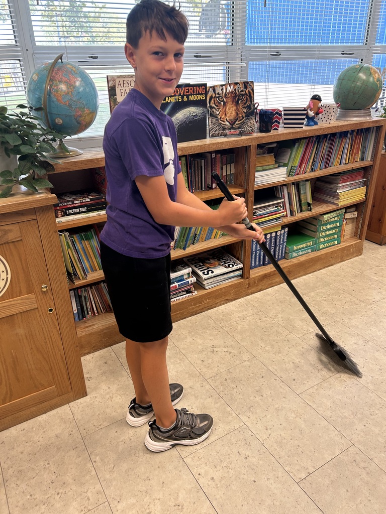 Mr. Yenni's students complete their classroom jobs.