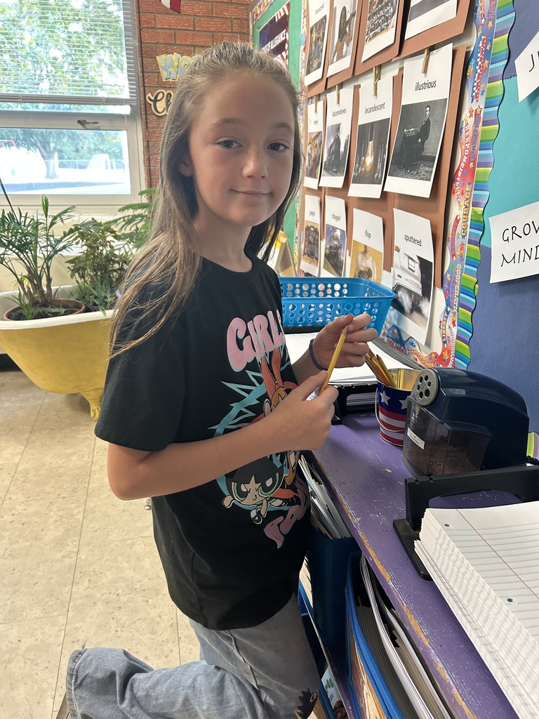 Mr. Yenni's students complete their classroom jobs.