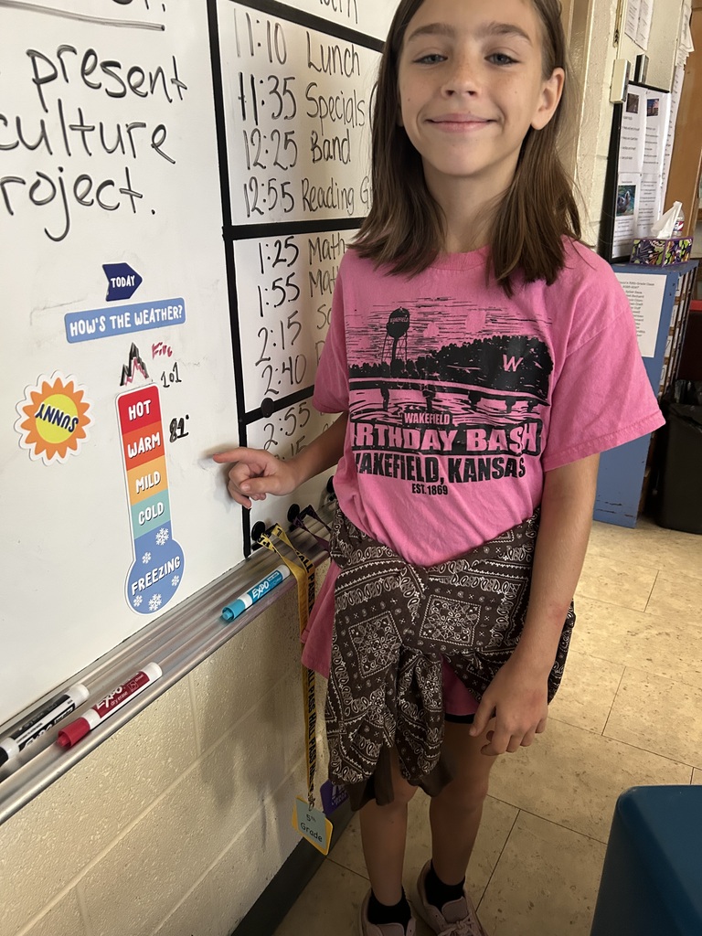 Mr. Yenni's students complete their classroom jobs.