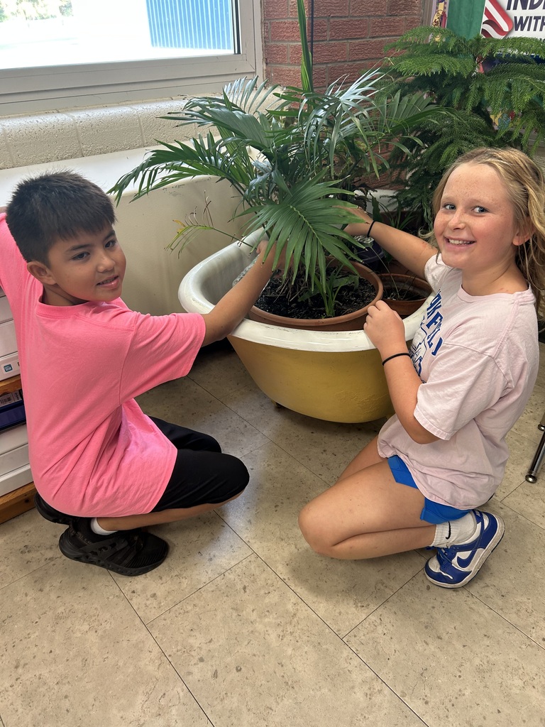 Mr. Yenni's students complete their classroom jobs.