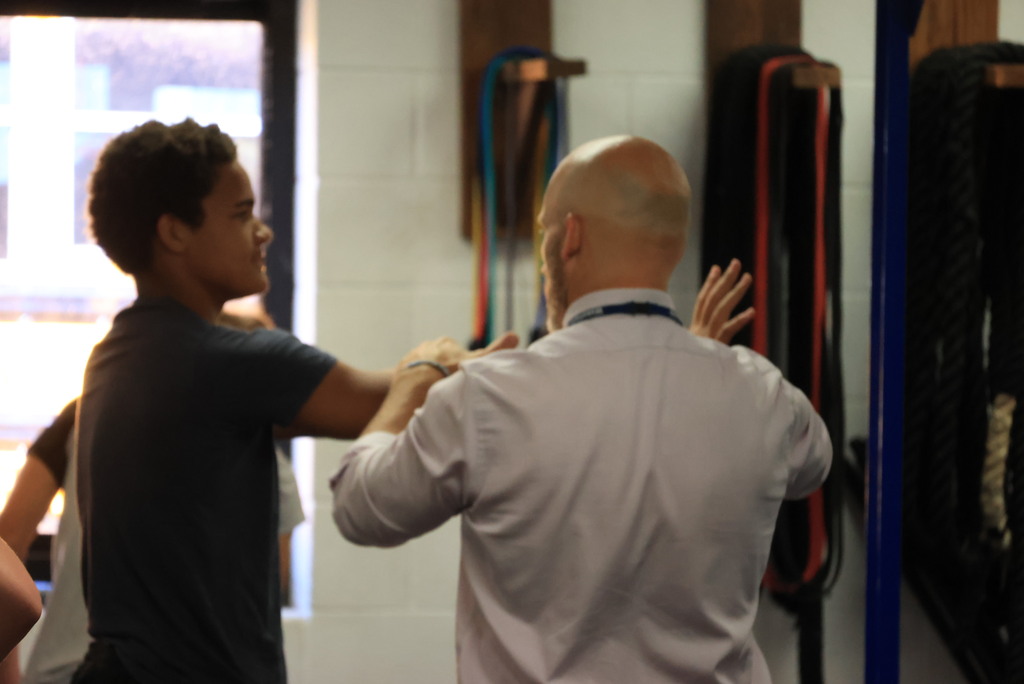 Every Thursday is Mobility Day in Mr. Freeman's strength and conditioning classes. His students are incorporating stretches and flexibility into his workout routine.