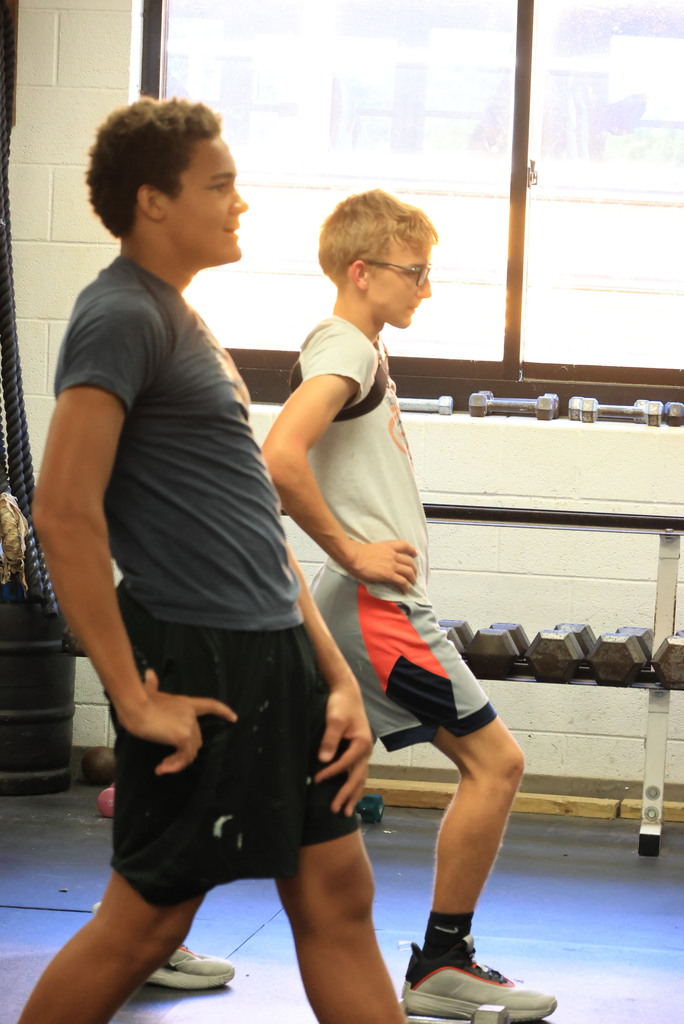 Every Thursday is Mobility Day in Mr. Freeman's strength and conditioning classes. His students are incorporating stretches and flexibility into his workout routine.