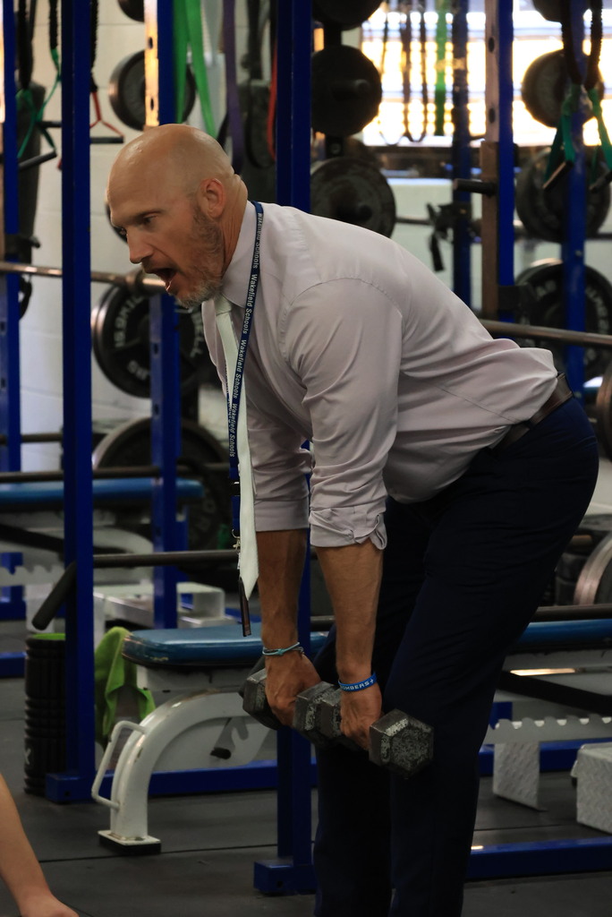 Every Thursday is Mobility Day in Mr. Freeman's strength and conditioning classes. His students are incorporating stretches and flexibility into his workout routine.
