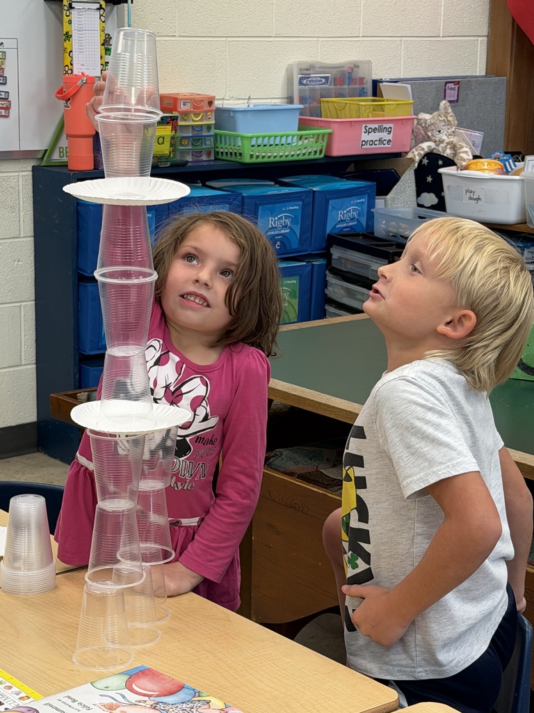 Mrs. Judy's K-1 class work on their leadership and teamwork skills by stacking cups in small groups.