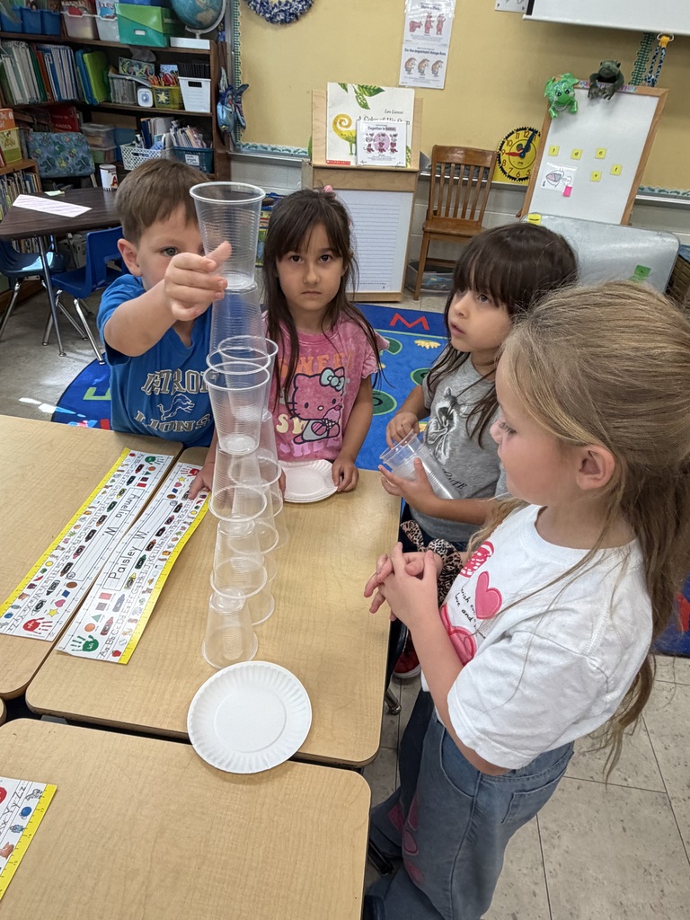 Mrs. Judy's K-1 class work on their leadership and teamwork skills by stacking cups in small groups.
