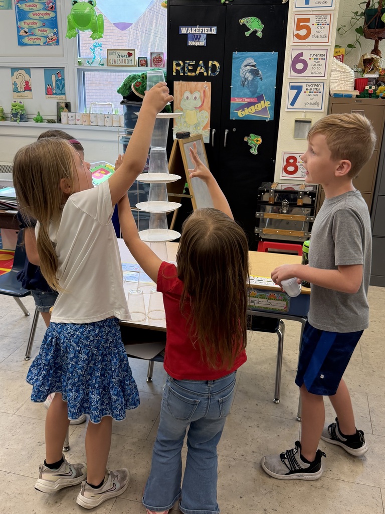 Mrs. Judy's K-1 class work on their leadership and teamwork skills by stacking cups in small groups.