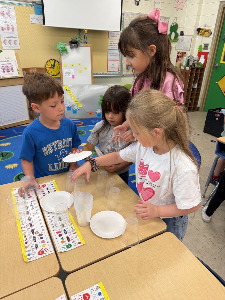 Mrs. Judy's K-1 class work on their leadership and teamwork skills by stacking cups in small groups.