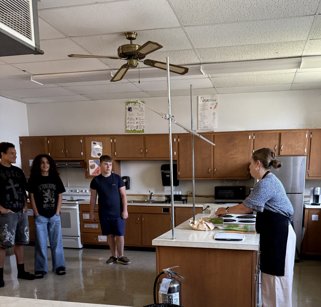 Students eat grilled cheese sandwiches that were prepared by Mrs. Hughes using directions written by her students.