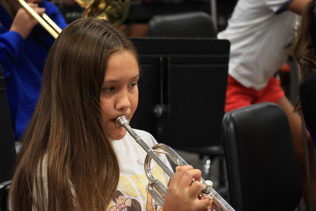 6th grade band students play their warmups to begin class.