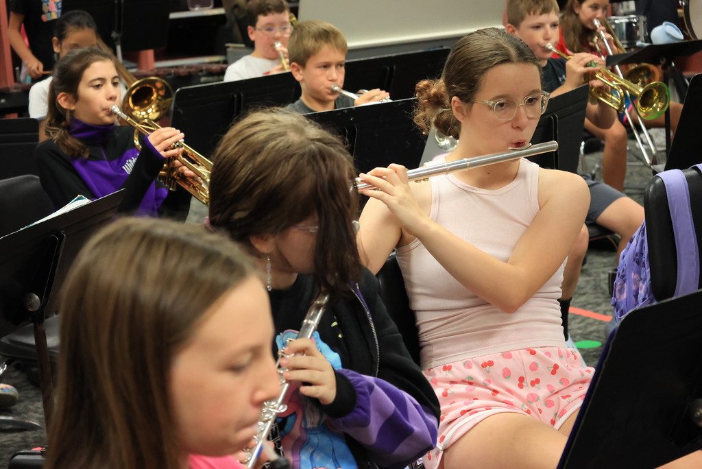 6th grade band students play their warmups to begin class.
