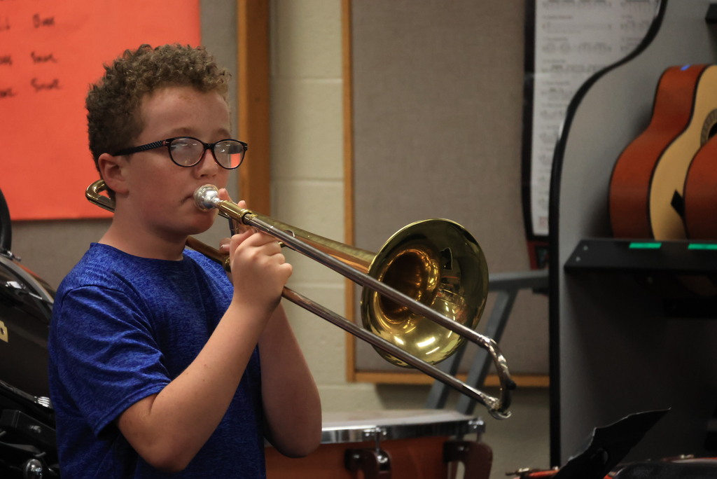6th grade band students play their warmups to begin class.