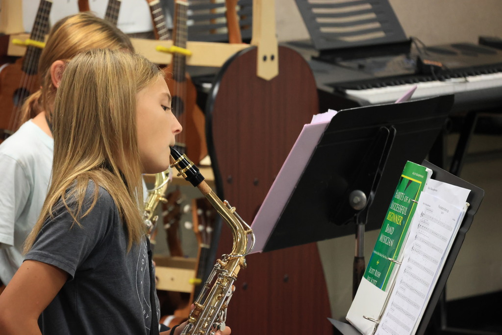 6th grade band students play their warmups to begin class.