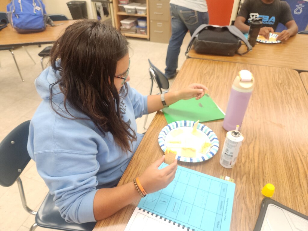Mrs. Flegler's welding students replicated weld positions using crackers and canned cheese.