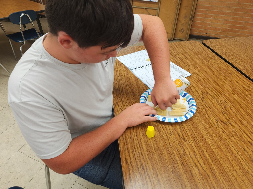 Mrs. Flegler's welding students replicated weld positions using crackers and canned cheese.