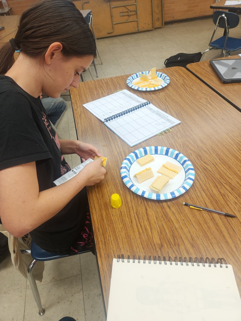 Mrs. Flegler's welding students replicated weld positions using crackers and canned cheese.