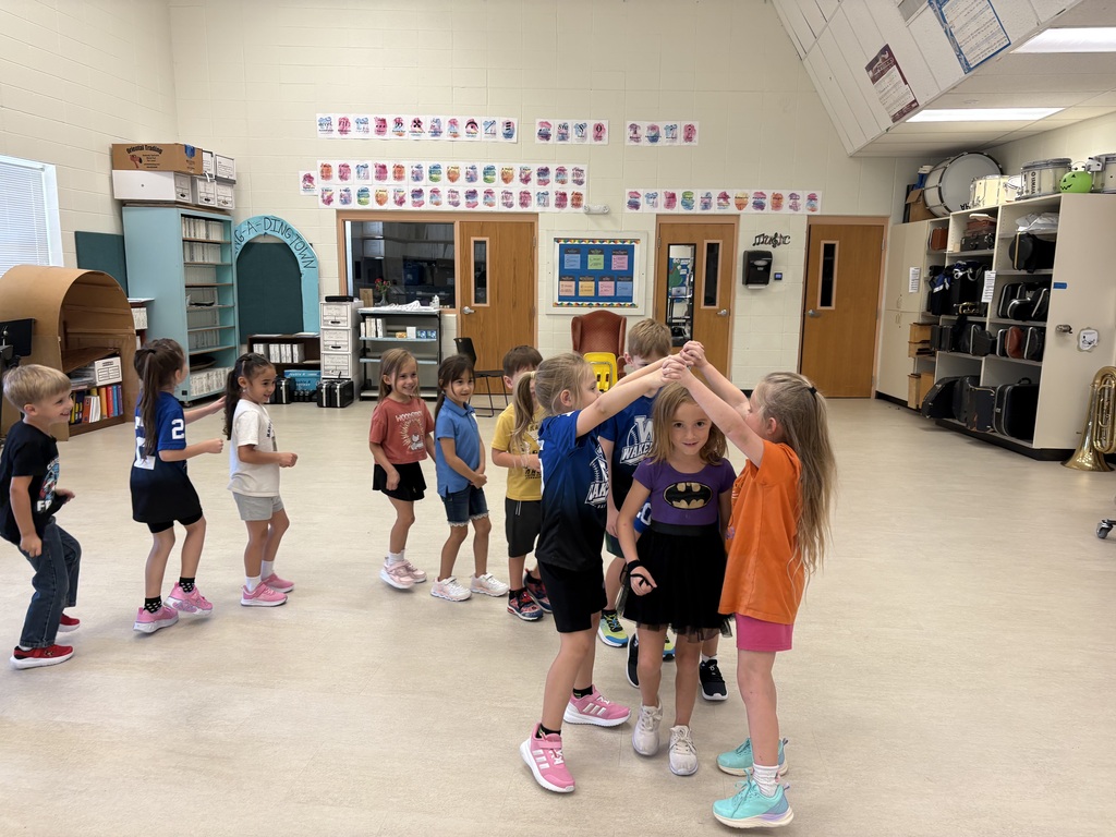 Mrs. Butler's kindergarten and first graders learn dance moves to the song, "London Bridge is Fallying Down".