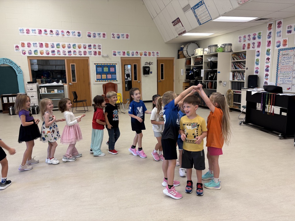 Mrs. Butler's kindergarten and first graders learn dance moves to the song, "London Bridge is Fallying Down".