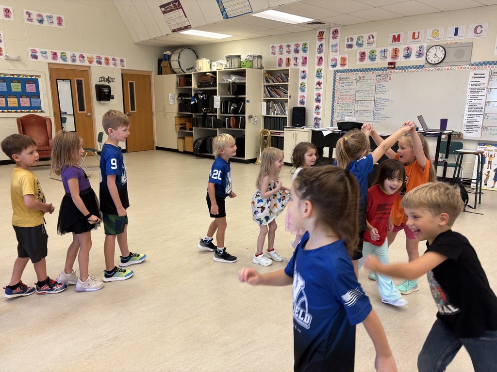 Mrs. Butler's kindergarten and first graders learn dance moves to the song, "London Bridge is Fallying Down".
