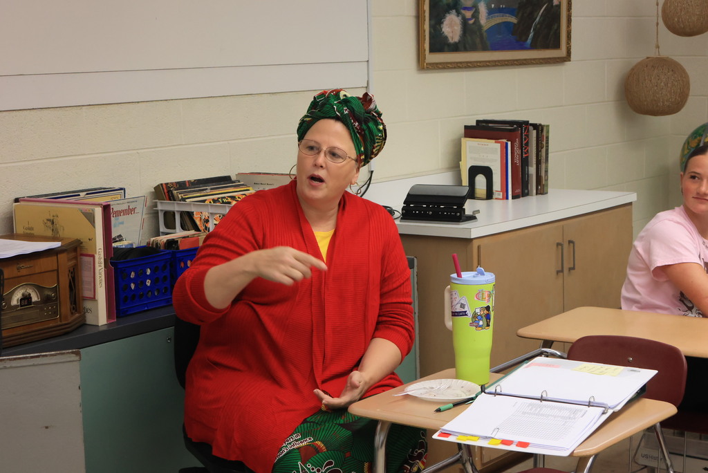 Miss TenClay hosted "Culture Day" in her classes. Each student brought something that showcased their family's culture. The goal was to show that although many students look similar, we all come from different backgrounds that deserve respect. Miss TenClay was wearing official Cameroon garb, where she taught for many years. 