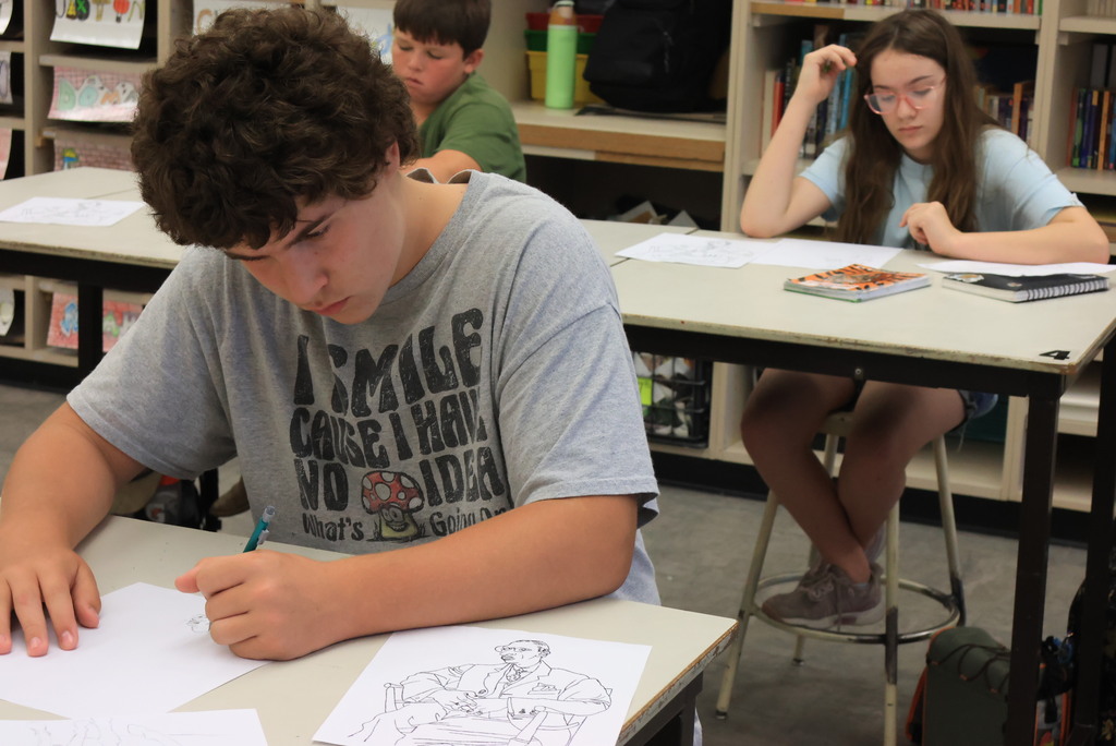 Mrs. Argo's 7th grade art class worked on contour line drawing by recreating a human drawing, only upside down. The goal is to learn to recreate lines rather than the image itself. 