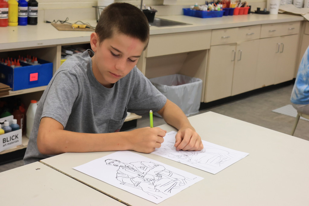 Mrs. Argo's 7th grade art class worked on contour line drawing by recreating a human drawing, only upside down. The goal is to learn to recreate lines rather than the image itself. 