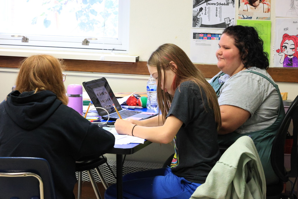 Mrs. Looney's junior high/high school art class are working on multiple projects. Some students were working on "zentangles", a method of creating miniature, abstract art using structured, repetitive patterns drawn one deliberate stroke at a time. Others were drawing their names in a unique way using sign-language hands.