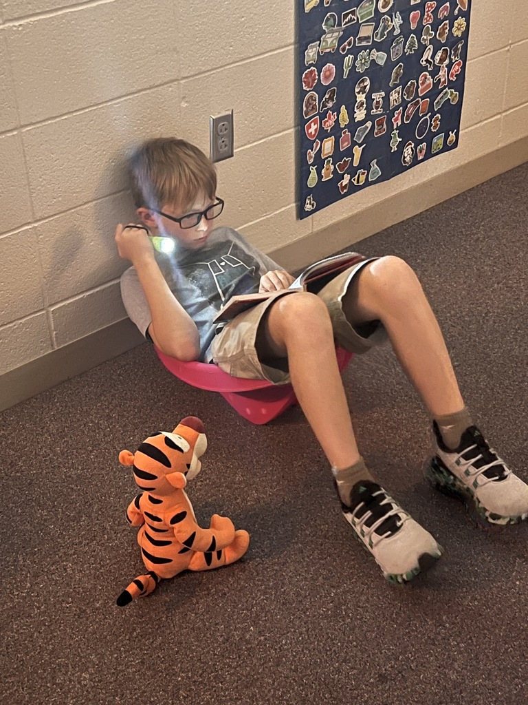 Mrs. Knepper's class reads in the dark as part of "Flashlight Friday".