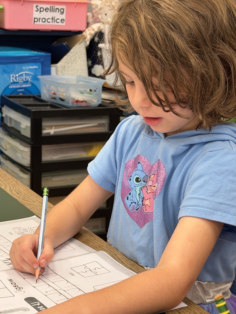 Mrs. Judy's K-1 class diligently works on correct letter formation in their handwriting.