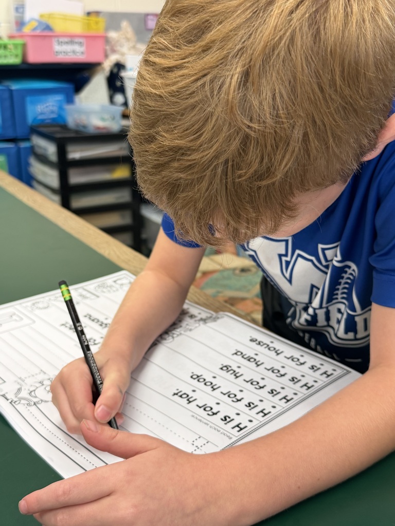 Mrs. Judy's K-1 class diligently works on correct letter formation in their handwriting.