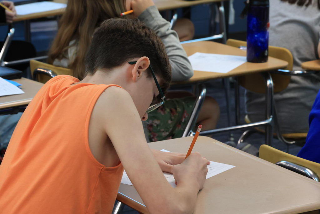 Mrs. Bybee's 7th grade math class was working hard on converting fractions, decimals, and percents today. Individual students came up to the board to solve their problems for the rest of the class.