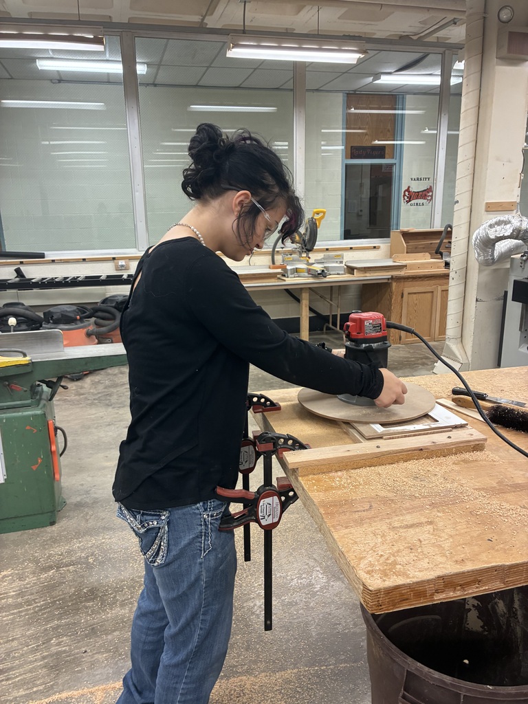 Earlier in the year, Mrs. Schooley's Cabinetmaking students worked with the Green Community Cafe to create a holder for their napkins, menus, salt and pepper shakers, and sugar containers. Last week, they started production!