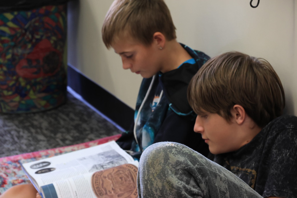 Mrs. Mellies' 7th grade social studies students partner read about the process of Kansas officially becoming a state.