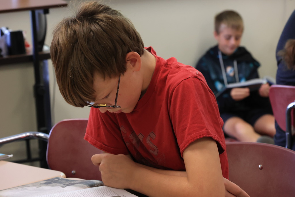 Mrs. Mellies' 7th grade social studies students partner read about the process of Kansas officially becoming a state.