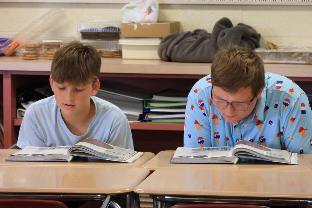 Mrs. Mellies' 7th grade social studies students partner read about the process of Kansas officially becoming a state.