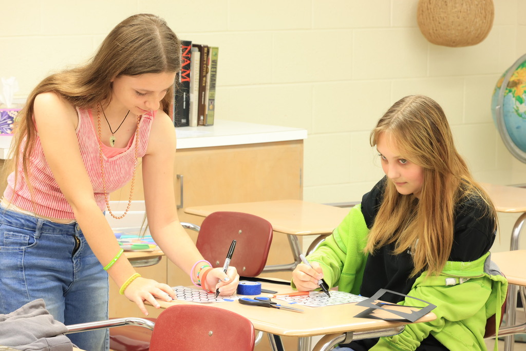 Ms. TenClay's World History students create their own art while learning about the differences between the two.