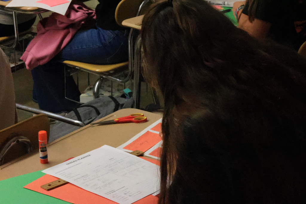 Mrs. Brenneman's first-year journalism students are going old-school with their initial yearbook designs, using paper and glue to create pages they will build later in the year. #Celebrate379
