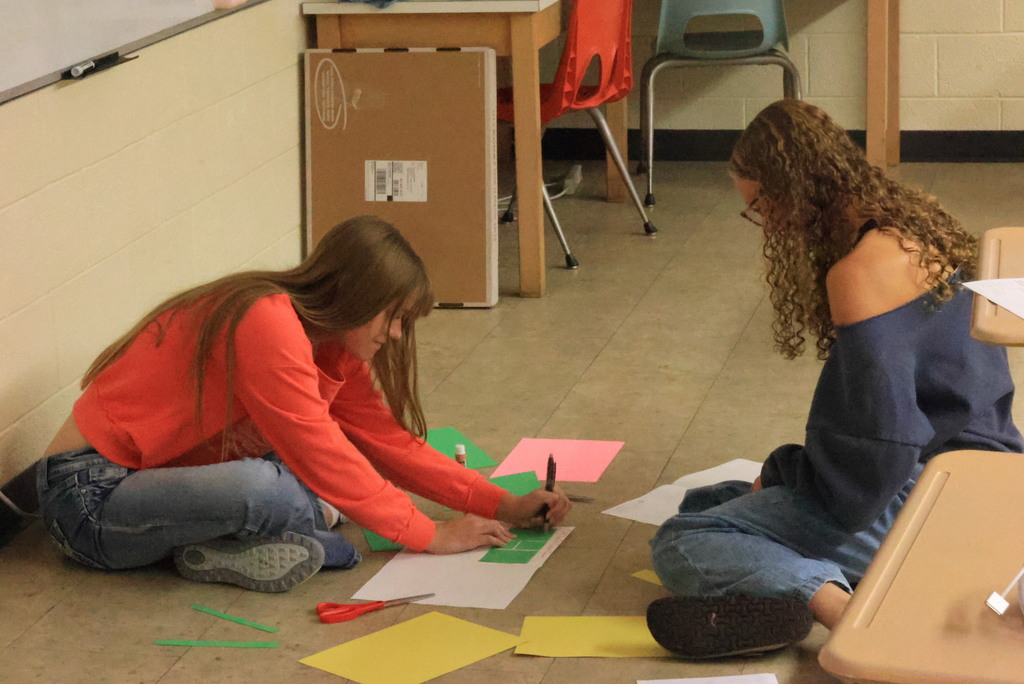 Mrs. Brenneman's first-year journalism students are going old-school with their initial yearbook designs, using paper and glue to create pages they will build later in the year. #Celebrate379