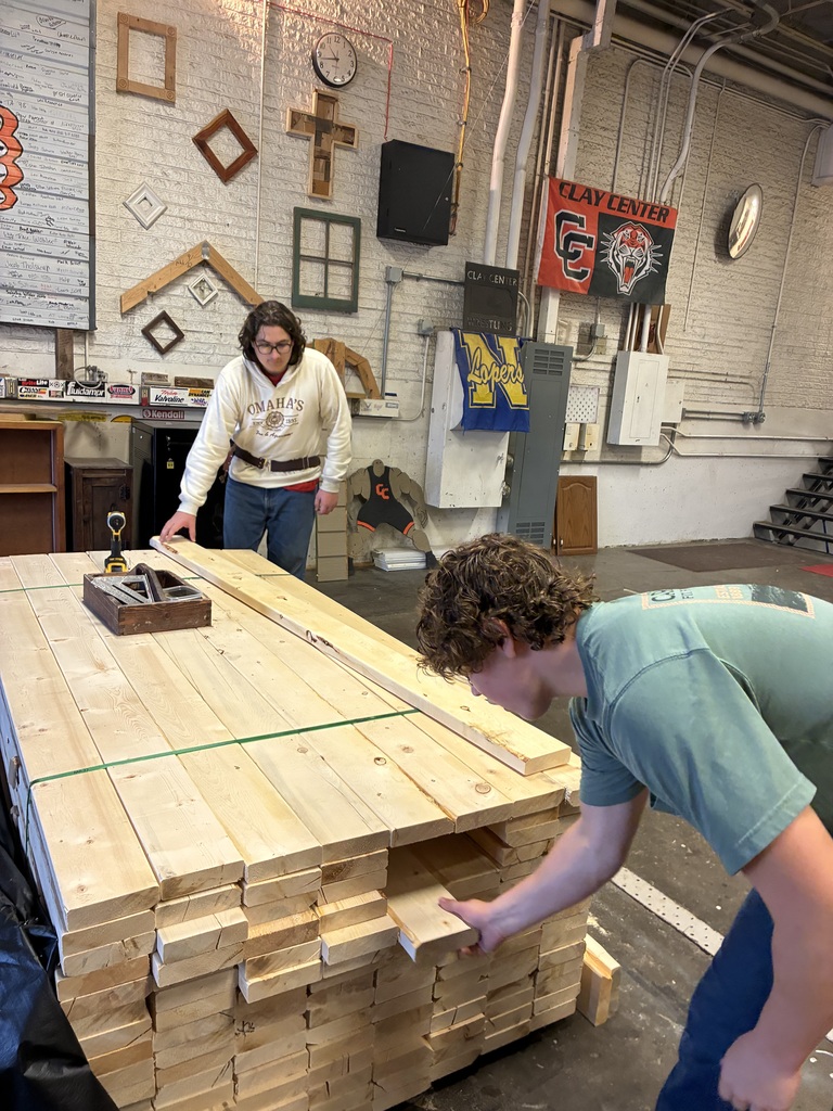 CCCHS construction technology students make headers and partitions and marking studs on the bottom and top plates. in the shop.