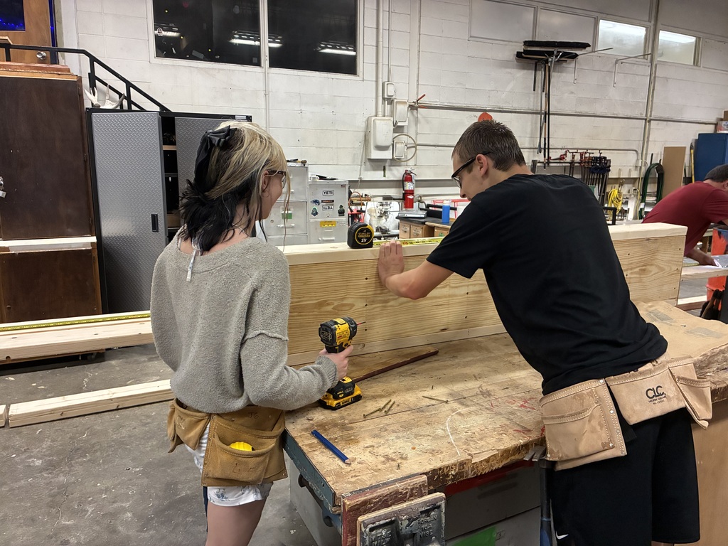 CCCHS construction technology students make headers and partitions and marking studs on the bottom and top plates. in the shop.