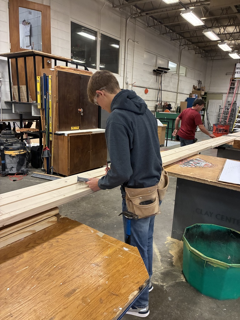CCCHS construction technology students make headers and partitions and marking studs on the bottom and top plates. in the shop.