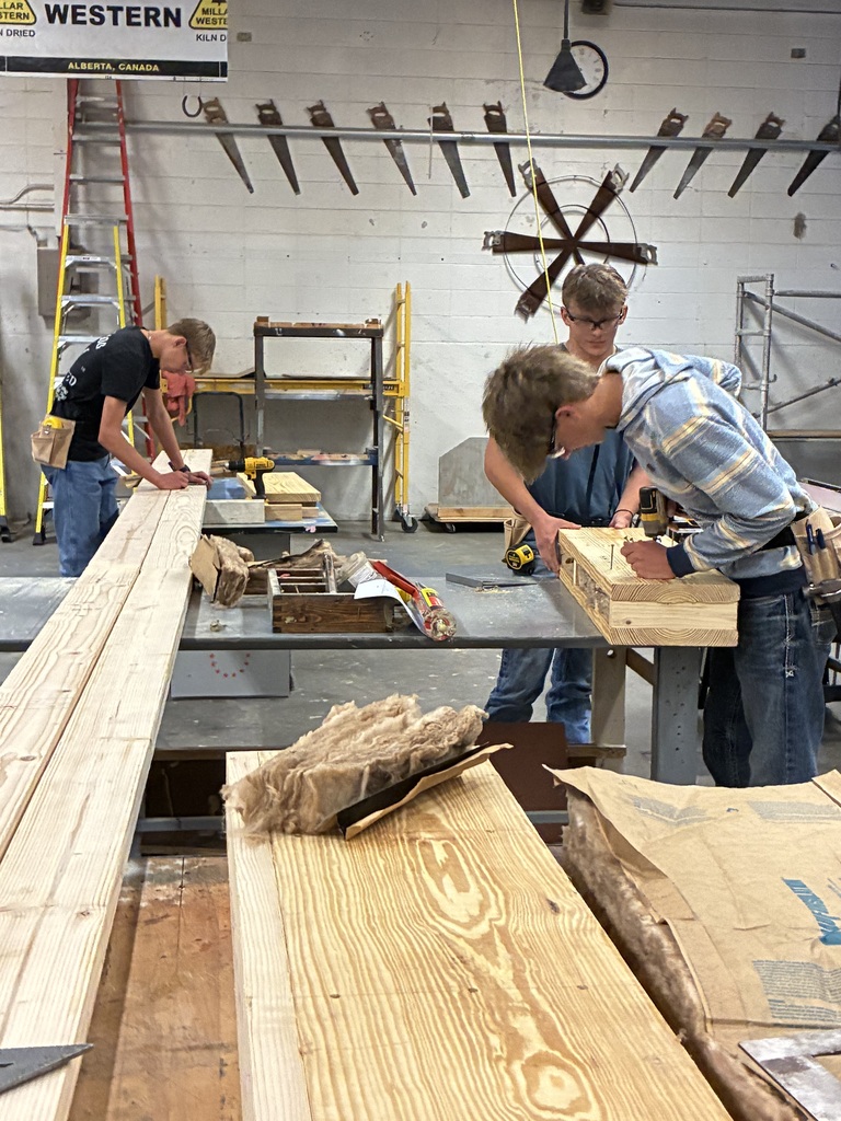 CCCHS construction technology students make headers and partitions and marking studs on the bottom and top plates. in the shop.