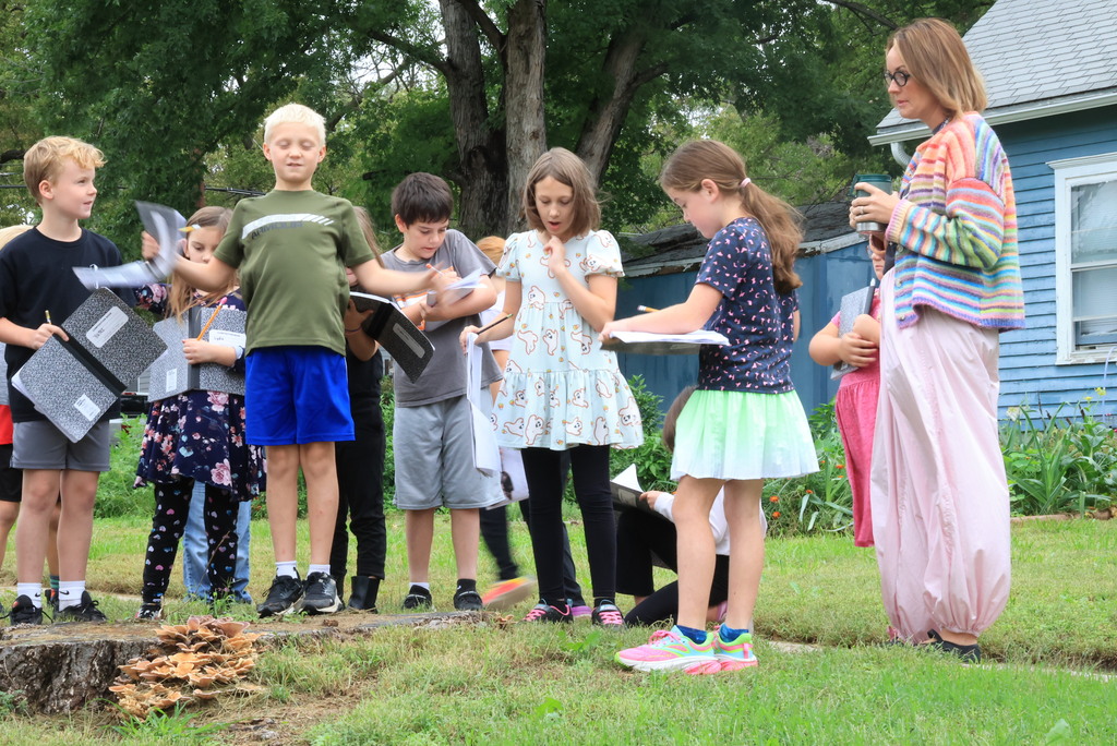 Mrs. Wietharn's 3rd graders document in their science notebooks while on a nature walk around the community.