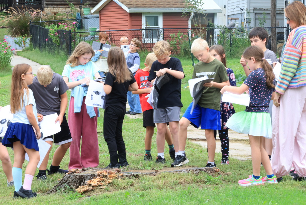 Mrs. Wietharn's 3rd graders document in their science notebooks while on a nature walk around the community.