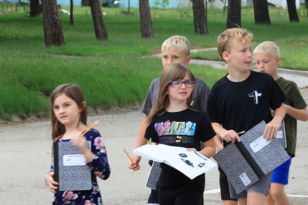 Mrs. Wietharn's 3rd graders document in their science notebooks while on a nature walk around the community.