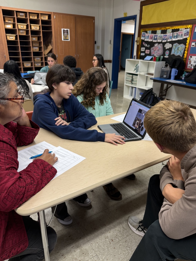 A group of native speakers from the community were invited in to describe a house they wanted built, and then Mrs. Hughes' Spanish students created and presented a design and argued why it was better than their classmates' designs. 