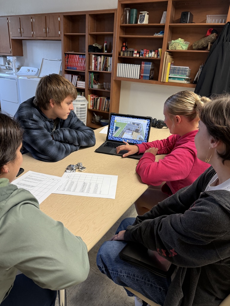 A group of native speakers from the community were invited in to describe a house they wanted built, and then Mrs. Hughes' Spanish students created and presented a design and argued why it was better than their classmates' designs. 