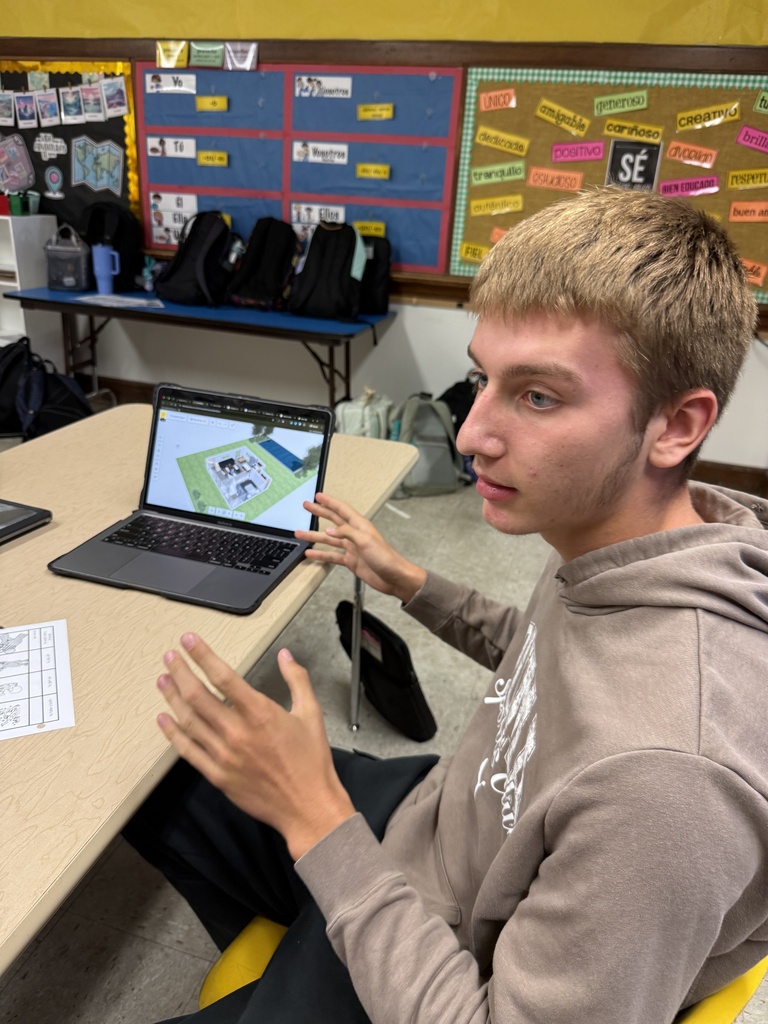 A group of native speakers from the community were invited in to describe a house they wanted built, and then Mrs. Hughes' Spanish students created and presented a design and argued why it was better than their classmates' designs. 