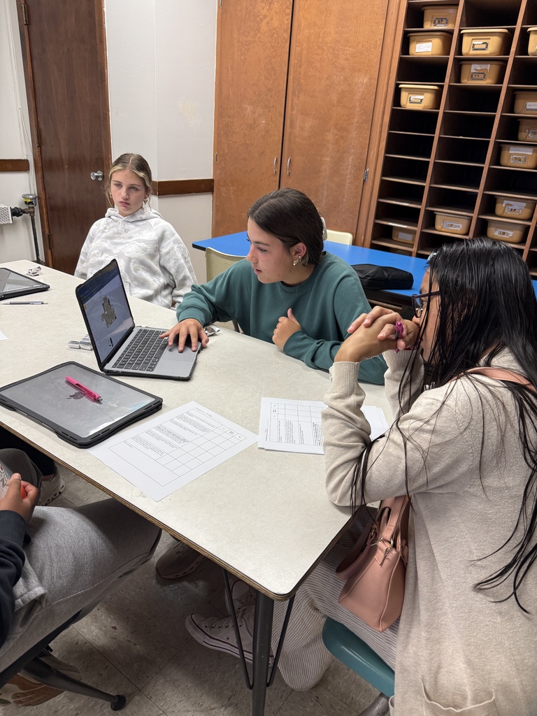 A group of native speakers from the community were invited in to describe a house they wanted built, and then Mrs. Hughes' Spanish students created and presented a design and argued why it was better than their classmates' designs. 