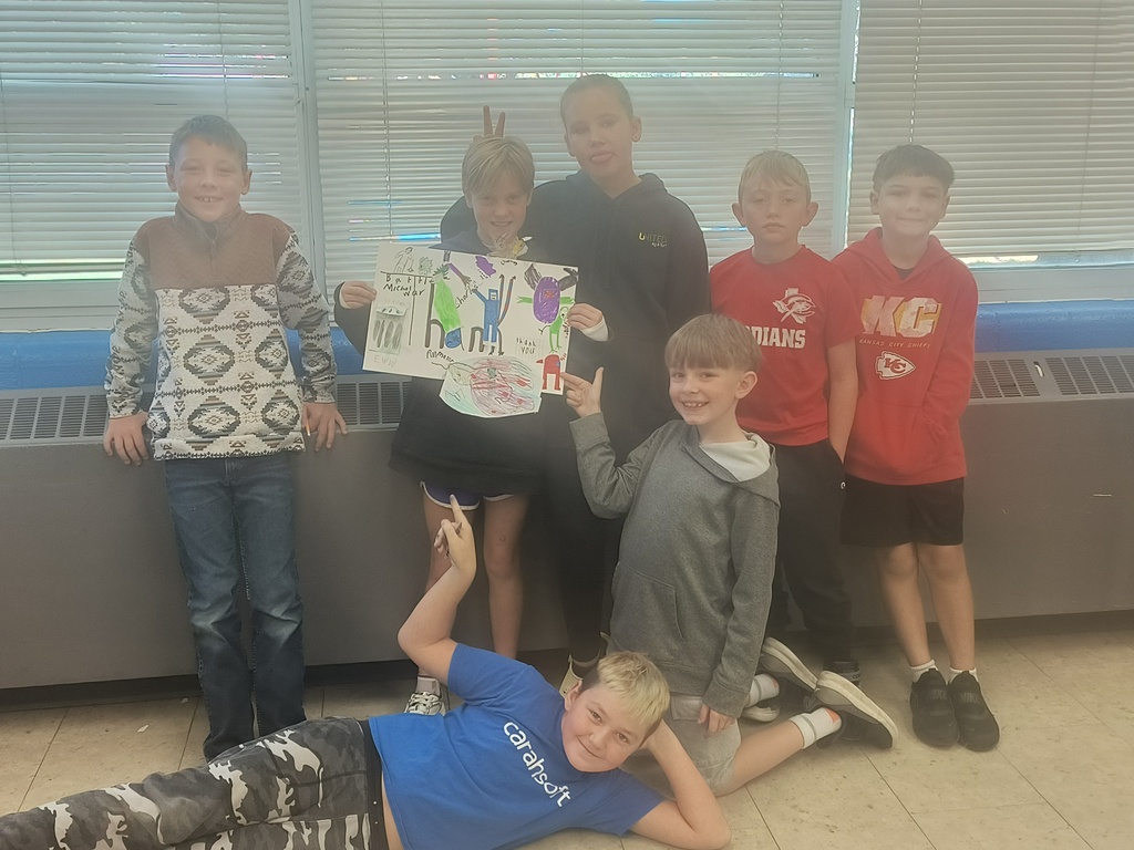 On National Custodians Day, Mrs. Simnitt's 4th graders created personalized posters and presented them to Mr. Langley and Mr. Dunlap.