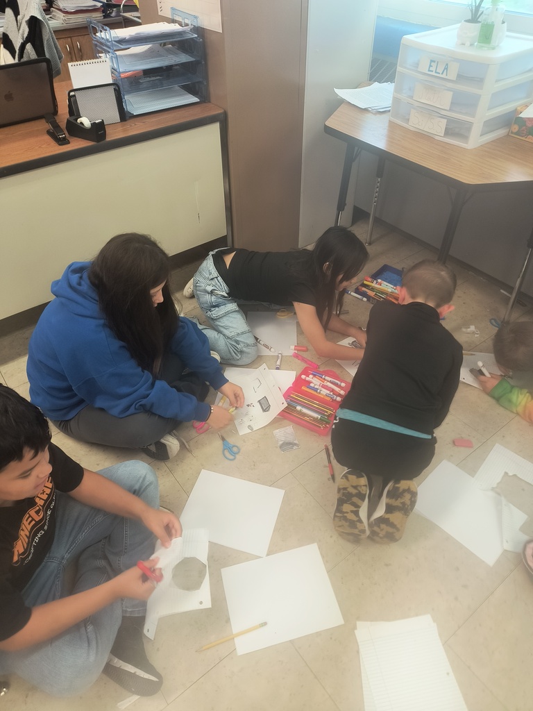 On National Custodians Day, Mrs. Simnitt's 4th graders created personalized posters and presented them to Mr. Langley and Mr. Dunlap.